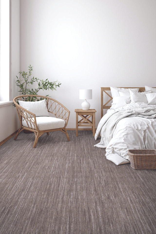 Bedroom with natural-toned carpet